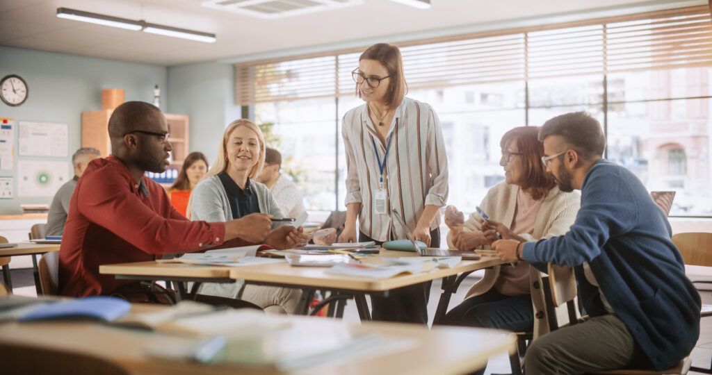 Group of colleagues meeting casually at table