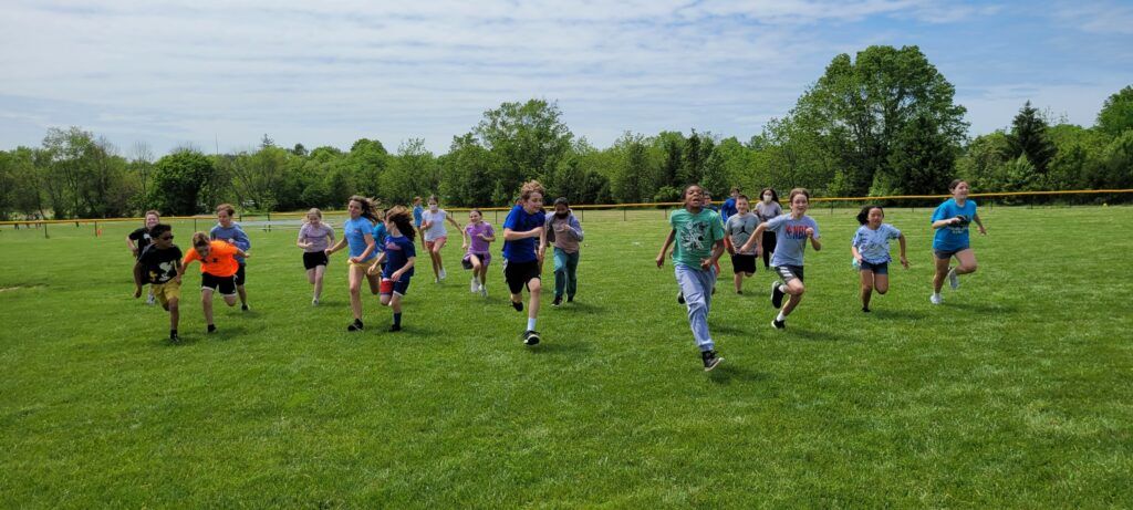 students running across a field