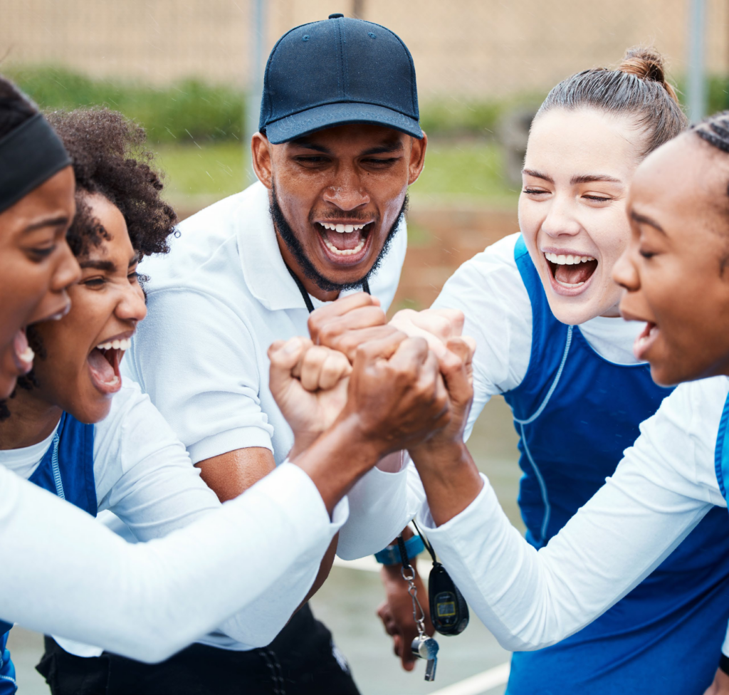 high school girls sports team cheering before game
